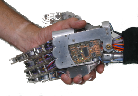 Man and robot shaking hands